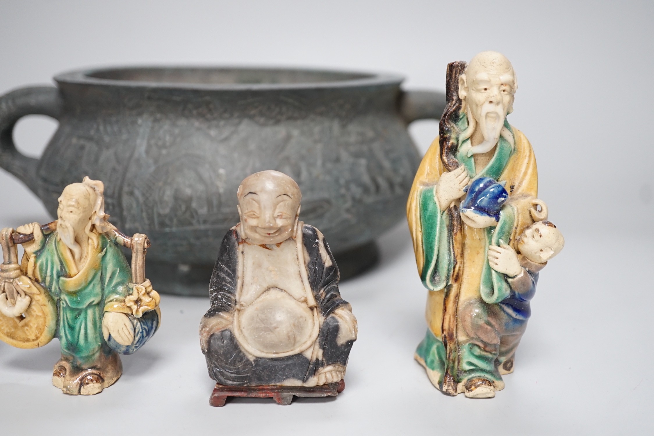A large late 19th/early 20th century Chinese bronze censer, gui, Xuande mark, together with four Chinese figures. Tallest 12cm
